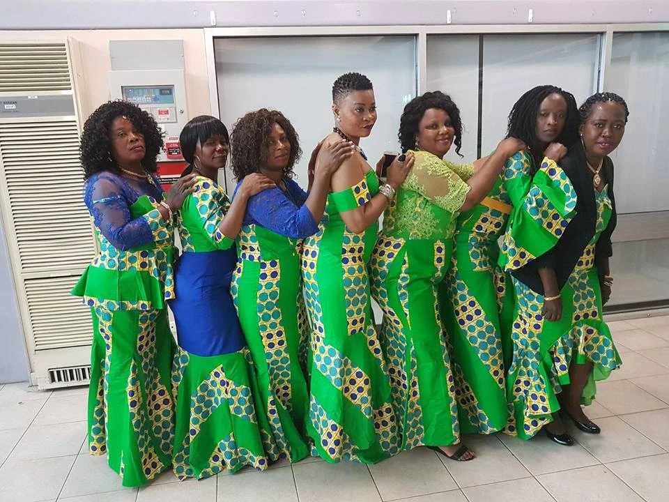 AKAA women in traditional green Vai cultural dresses